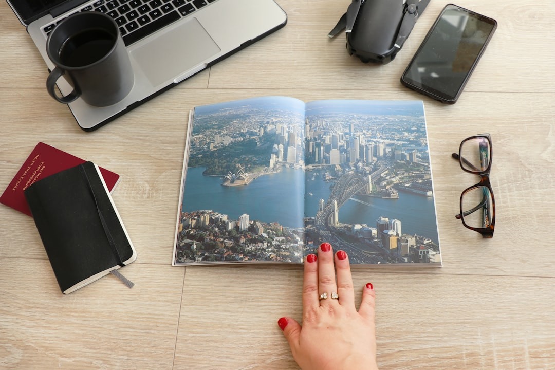 Person reviewing tax documents with a calculator and passport while planning a move abroad